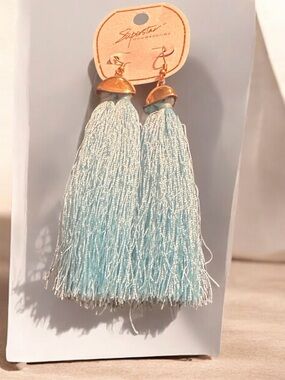 Superstar Light Blue Tassel Drop Earrings with Gold Accents
670